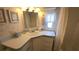 Bathroom with vanity, sink, and shower bathtub combo at 3333 26Th E Ave # 1148, Bradenton, FL 34208