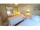 Bright bedroom with twin beds and mirrored closet at 3333 26Th E Ave # 1148, Bradenton, FL 34208