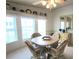 Charming dining area with a round table and comfortable seating and neutral colored decor at 3333 26Th E Ave # 1148, Bradenton, FL 34208