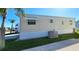 Exterior view of mobile home and AC unit at 3333 26Th E Ave # 1148, Bradenton, FL 34208