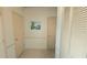 Home hallway with two closets and artwork at 3333 26Th E Ave # 1148, Bradenton, FL 34208