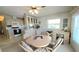 Eat-in kitchen with white cabinetry, a dining table and chairs set, and a built-in desk at 3333 26Th E Ave # 1148, Bradenton, FL 34208