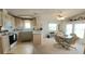 Eat-in kitchen featuring white cabinetry, modern appliances, and a cozy dining area at 3333 26Th E Ave # 1148, Bradenton, FL 34208