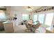 Kitchen with a cozy dining area and white cabinetry, and plenty of natural light at 3333 26Th E Ave # 1148, Bradenton, FL 34208