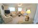Cozy living room with bright natural light, ceiling fan and neutral color furniture at 3333 26Th E Ave # 1148, Bradenton, FL 34208