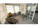 Sunroom with four chairs and a view of the surrounding neighborhood at 3333 26Th E Ave # 1148, Bradenton, FL 34208