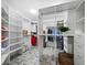 Large walk-in closet with ample shelving and hanging space at 3427 Winding Oaks Dr # 14, Longboat Key, FL 34228