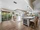 Modern kitchen with white cabinets and a large island at 3427 Winding Oaks Dr # 14, Longboat Key, FL 34228