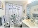 Clean bathroom with shower/tub combo and sunflowers decor at 3640 Ironwood Cir # 601N, Bradenton, FL 34209