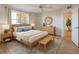 Inviting bedroom with a queen-sized bed, dresser, and ample natural light at 3640 Ironwood Cir # 601N, Bradenton, FL 34209