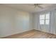 Empty bedroom with wood floors, a window, and light-colored walls at 3640 Ironwood Cir # 601N, Bradenton, FL 34209