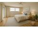 Cozy bedroom with a queen-sized bed, soft lighting, and a view to the exterior at 3640 Ironwood Cir # 601N, Bradenton, FL 34209