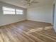 Spacious bedroom featuring wood-look floors and a ceiling fan at 3640 Ironwood Cir # 601N, Bradenton, FL 34209