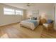 Bright bedroom with a queen-sized bed, a ceiling fan, and natural light at 3640 Ironwood Cir # 601N, Bradenton, FL 34209