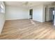 Spacious bedroom with wood-look floors and access to bathroom at 3640 Ironwood Cir # 601N, Bradenton, FL 34209