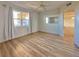 Bedroom with wood-look floors, window, and ceiling fan at 3640 Ironwood Cir # 601N, Bradenton, FL 34209