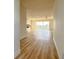 Bright condo entryway with wood-look floors leading to living room at 3640 Ironwood Cir # 601N, Bradenton, FL 34209