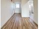 Bright hallway with light brown laminate flooring at 3640 Ironwood Cir # 601N, Bradenton, FL 34209