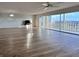 Spacious living room featuring wood-look floors and access to balcony at 3640 Ironwood Cir # 601N, Bradenton, FL 34209