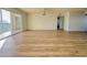 Bright and airy living room with laminate floors and balcony at 3640 Ironwood Cir # 601N, Bradenton, FL 34209