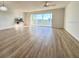 Living room with balcony access and laminate flooring at 3640 Ironwood Cir # 601N, Bradenton, FL 34209