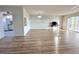 Spacious living room with wood-look floors and access to balcony at 3640 Ironwood Cir # 601N, Bradenton, FL 34209