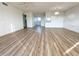 Bright living room with wood-look floors and sliding doors to balcony at 3640 Ironwood Cir # 601N, Bradenton, FL 34209