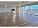 Spacious living room featuring wood-look floors and access to balcony at 3640 Ironwood Cir # 601N, Bradenton, FL 34209