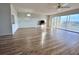 Spacious living room featuring wood-look floors and access to balcony at 3640 Ironwood Cir # 601N, Bradenton, FL 34209