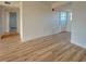 Spacious living room featuring light brown laminate flooring at 3640 Ironwood Cir # 601N, Bradenton, FL 34209