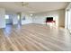 Open living space with laminate flooring and access to balcony at 3640 Ironwood Cir # 601N, Bradenton, FL 34209