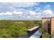 Covered parking area with a view of the surrounding landscape at 3640 Ironwood Cir # 601N, Bradenton, FL 34209