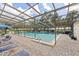Community pool with lounge chairs and patio umbrella at 3640 Ironwood Cir # 601N, Bradenton, FL 34209