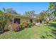 View of the home's exterior showcasing a partially fenced backyard at 3941 Oakhurst Blvd # 3014, Sarasota, FL 34233