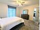 Simple bedroom with double bed and dresser, plus a view of the kitchen at 4114 43Rd W Ave, Bradenton, FL 34205