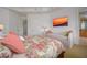 Main bedroom with king-size bed, daybed, and a view into the bathroom at 4125 Gulf Of Mexico Dr # S201, Longboat Key, FL 34228
