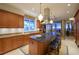 Kitchen with granite island, breakfast bar, and ocean view at 4125 Gulf Of Mexico Dr # S201, Longboat Key, FL 34228