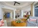 Living room with access to kitchen and formal dining area at 4125 Gulf Of Mexico Dr # S201, Longboat Key, FL 34228