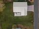 Single-story home with a metal roof and small deck at 4528 106Th W St, Bradenton, FL 34210