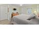 Cozy bedroom with a queen bed and access to a private door at 4528 106Th W St, Bradenton, FL 34210