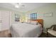 Spacious bedroom with a queen bed and built-in shelving at 4528 106Th W St, Bradenton, FL 34210