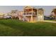 Two-story house with a large deck, stairs and fenced yard at 4528 106Th W St, Bradenton, FL 34210