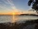 Sunrise over calm water with a pier and shoreline at 4528 106Th W St, Bradenton, FL 34210