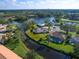 Waterfront property with lush landscaping at 4975 Waterbridge Down, Sarasota, FL 34235