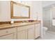 Bathroom with granite countertop, updated vanity, and shower at 4975 Waterbridge Down, Sarasota, FL 34235