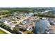 Aerial view of condo community with water features, manicured landscaping, swimming pool and assigned parking at 502 Woodstork Cir, Bradenton, FL 34209