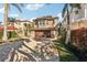 The Mediterranean-style home features a tile roof, bay window, and a two-car garage with a paver driveway at 5159 Oxford Dr, Sarasota, FL 34242