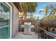 Outdoor grill area featuring a stainless steel grill with a view of the lush tropical landscaping at 5159 Oxford Dr, Sarasota, FL 34242