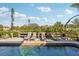 Tranquil pool with lounge chairs and a wooden deck at 5159 Oxford Dr, Sarasota, FL 34242