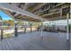Expansive outdoor deck under a covered structure, providing ample space for outdoor entertainment and leisure at 521 Cummings St, Sarasota, FL 34242